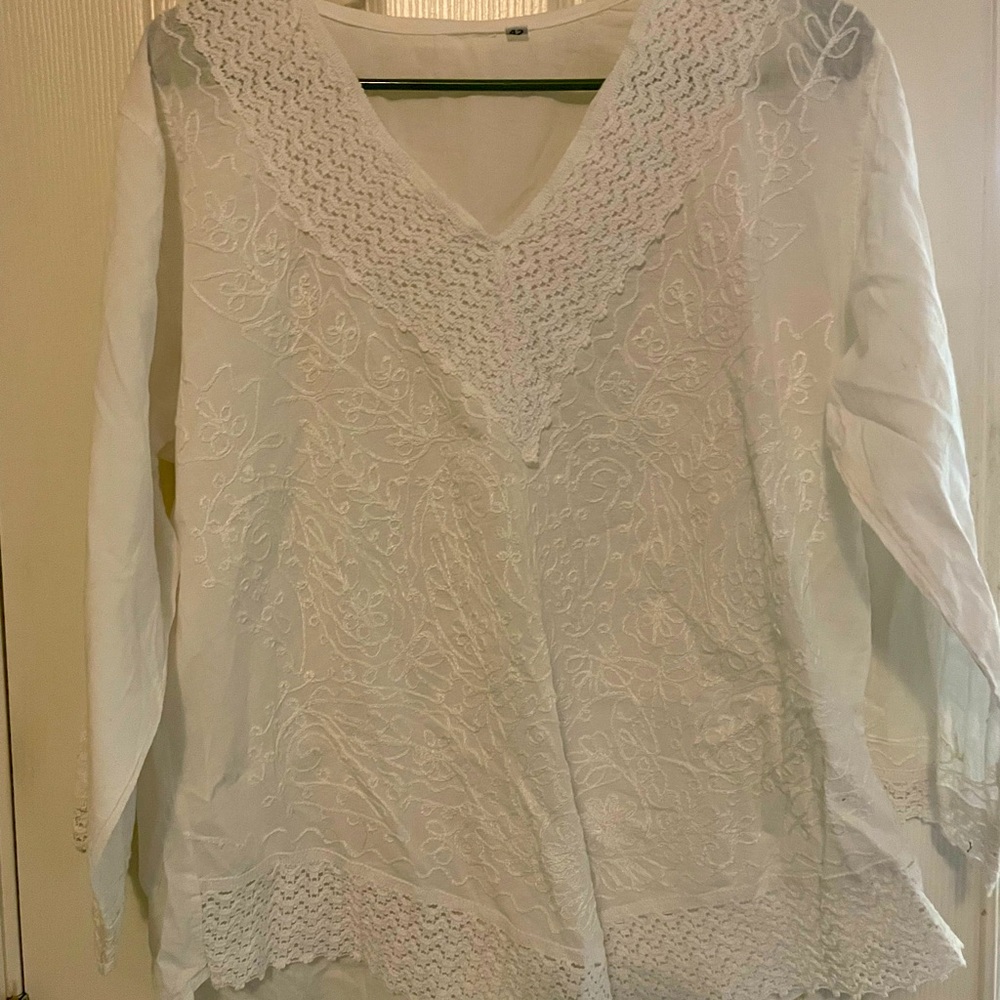 White large v neck top with decorative sleeves and bottom